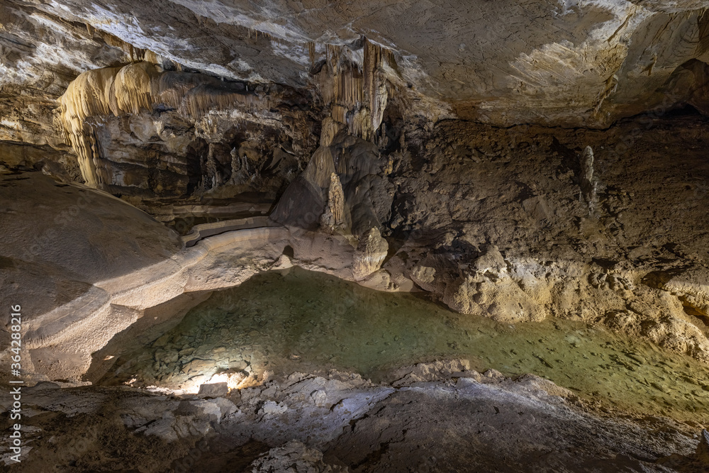Stalagmites and stalactites in the Kalvaria hall in Krizna Jama karst cave Stalagmites and stalactites in the Kalvaria hall in Krizna Jama karst cave