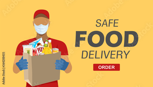 Safe food delivery at home during coronavirus epidemic: delivery man holding a bag with fast food, he is wearing a face mask and gloves
