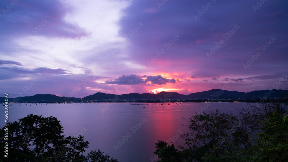 Beautiful dramatic sky sunset or sunrise over the tropical sea scenery of beautiful nature background in phuket thailand.