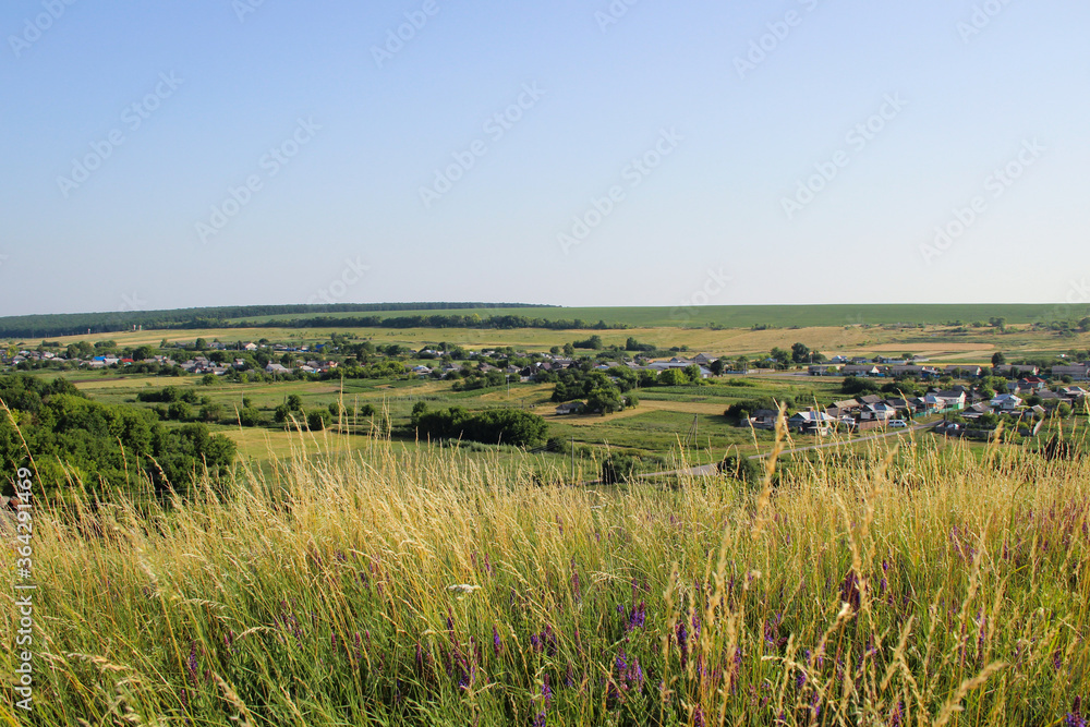 Beautiful view of a Russian village from the hill. Lovely little houses.