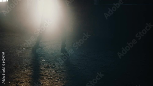 Woman air boxing in an abandoned building photo