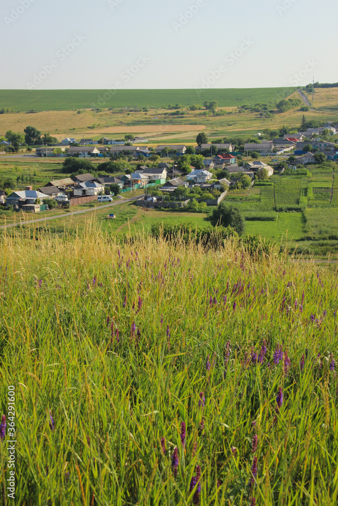 Beautiful view of a Russian village from the hill. Lovely little houses. Beautiful view of a Russian village from the hill. Lovely little houses.