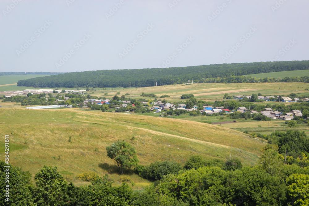 Beautiful view of a Russian village from the hill. Lovely little houses.