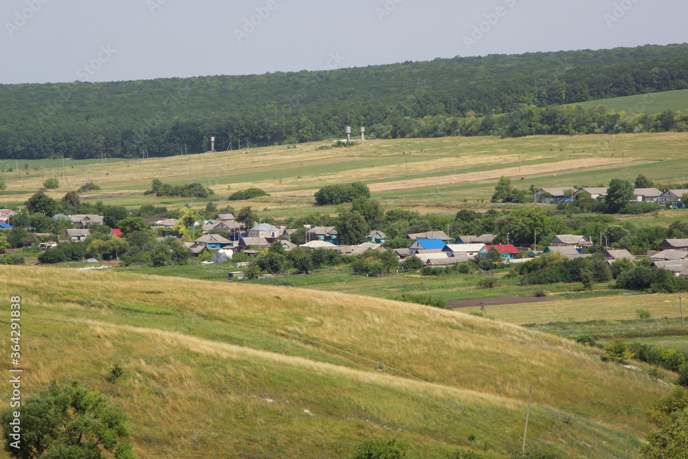 Beautiful view of a Russian village from the hill. Lovely little houses.