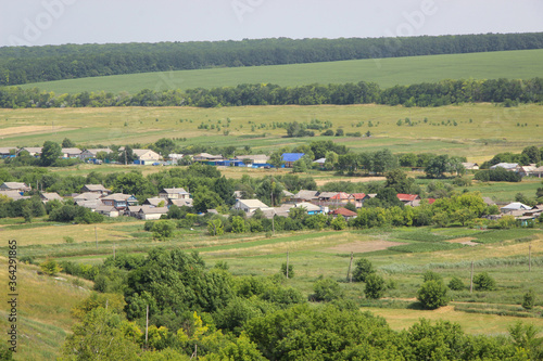 Beautiful view of a Russian village from the hill. Lovely little houses.