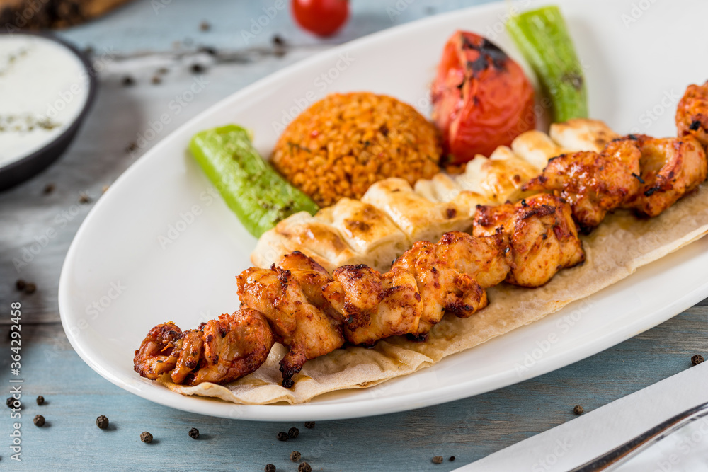 Traditional Turkish grilled Chicken shish kebab with vegetables grilled on skewers