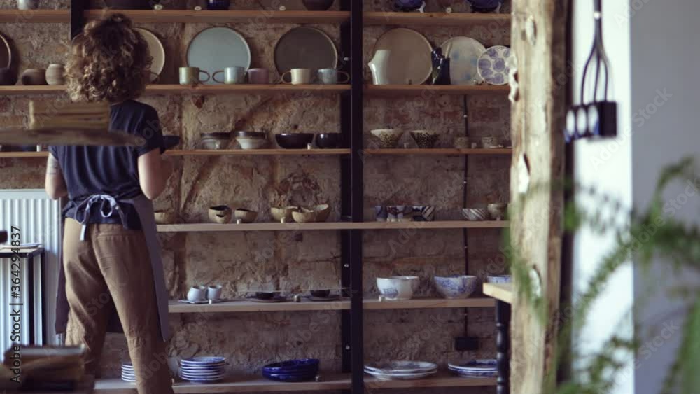 Woman pottery artist working in her art studio
Woman pottery artist working in her art studio