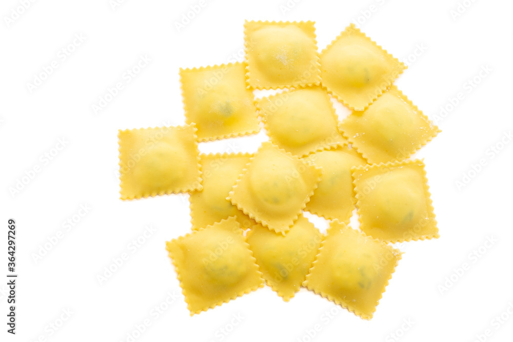 Fresh Ravioli pasta golden color isolated on white background, top view