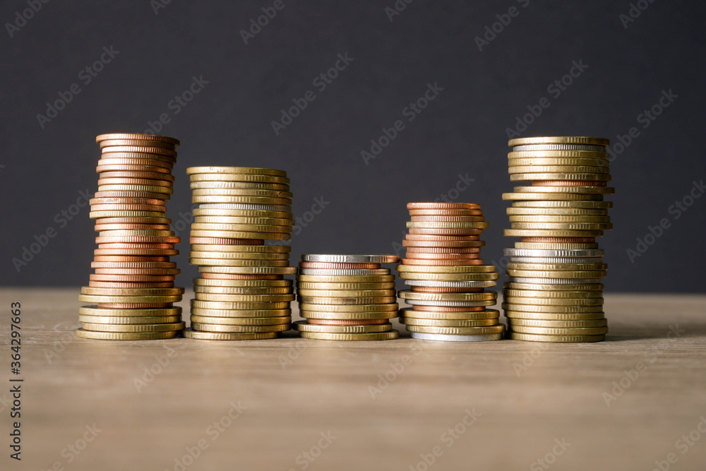 stack of coins on black background stack of coins on black background