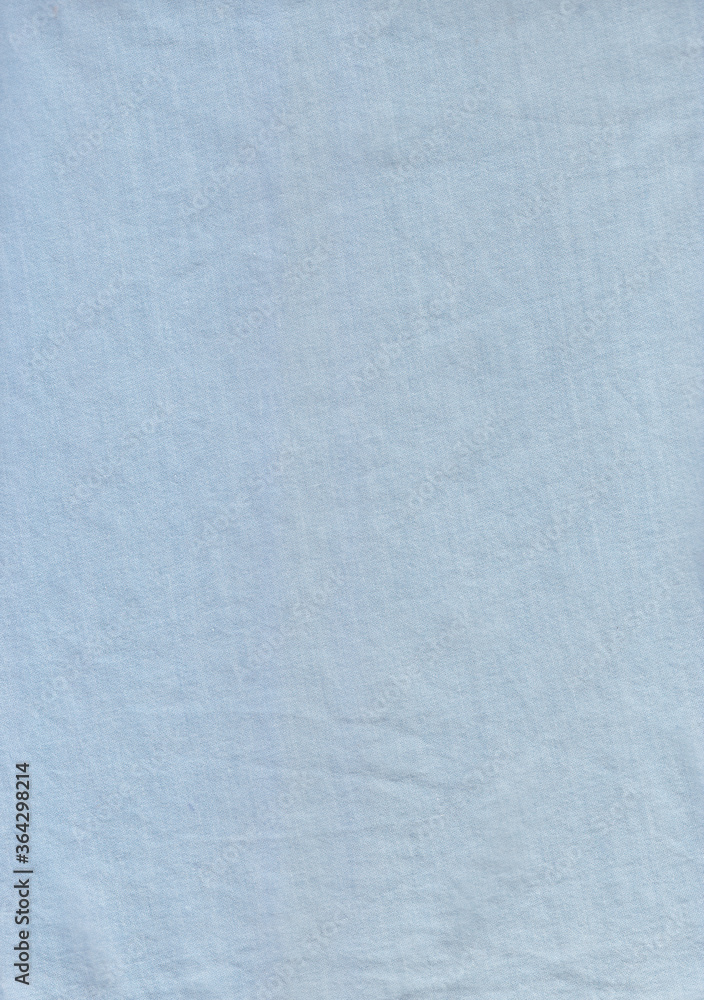A sky blue color fabric Background. A jeans fabric use for making shirt.