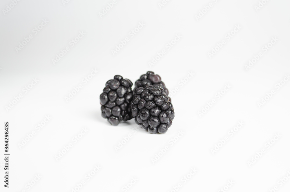 Three fresh ripe blackberries on white background Three fresh ripe blackberries on white background