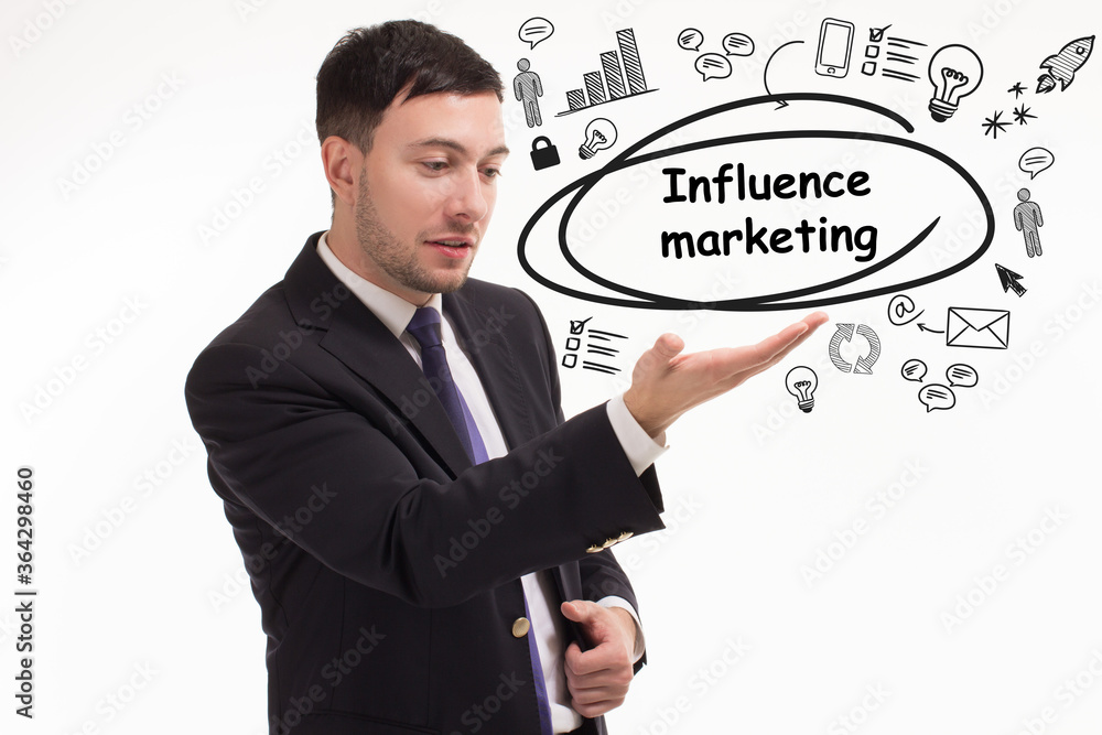 Business, technology, internet and network concept. Young businessman thinks over the steps for successful growth: Influence marketing Business, technology, internet and network concept. Young businessman thinks over the steps for successful growth: Influence marketing