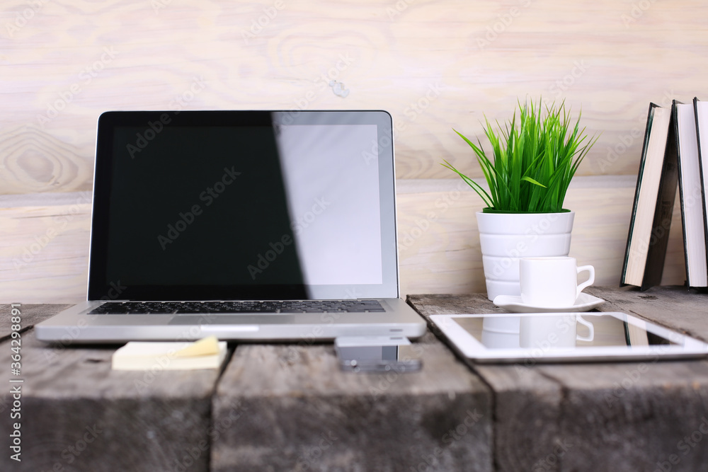 Stylish workspace with computer and posters on home or studio Stylish workspace with computer and posters on home or studio