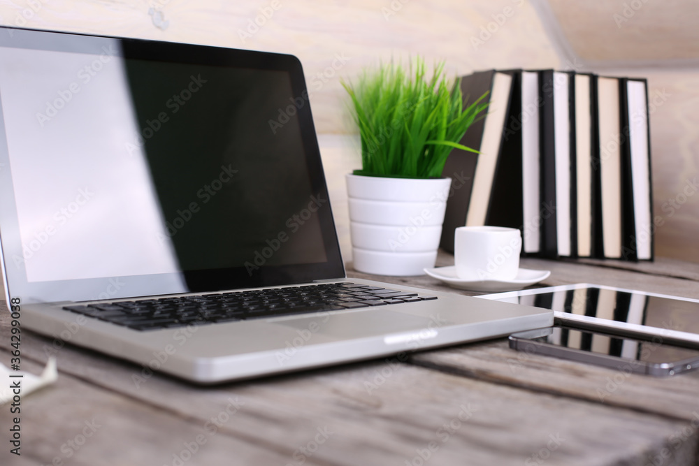 Stylish workspace with computer and posters on home or studio Stylish workspace with computer and posters on home or studio