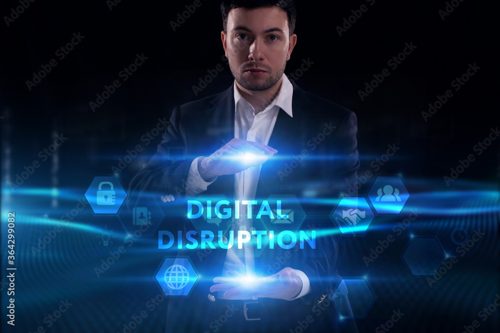 Business, Technology, Internet and network concept. Young businessman working on a virtual screen of the future and sees the inscription: Digital disruption