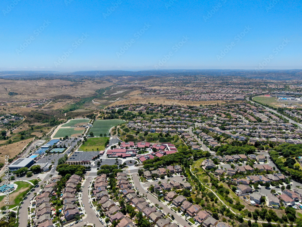 Aerial view of suburban neighborhood with big mansions in San Diego, California, USA. Aerial view of residential modern subdivision luxury house.