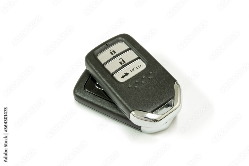 New car wave key with remote control on white background, isolated. New car wave key with remote control on white background, isolated.