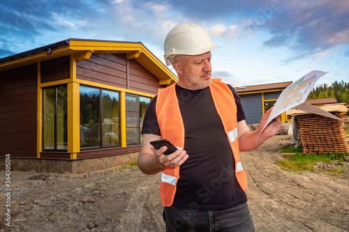 Man near a newly built cott...