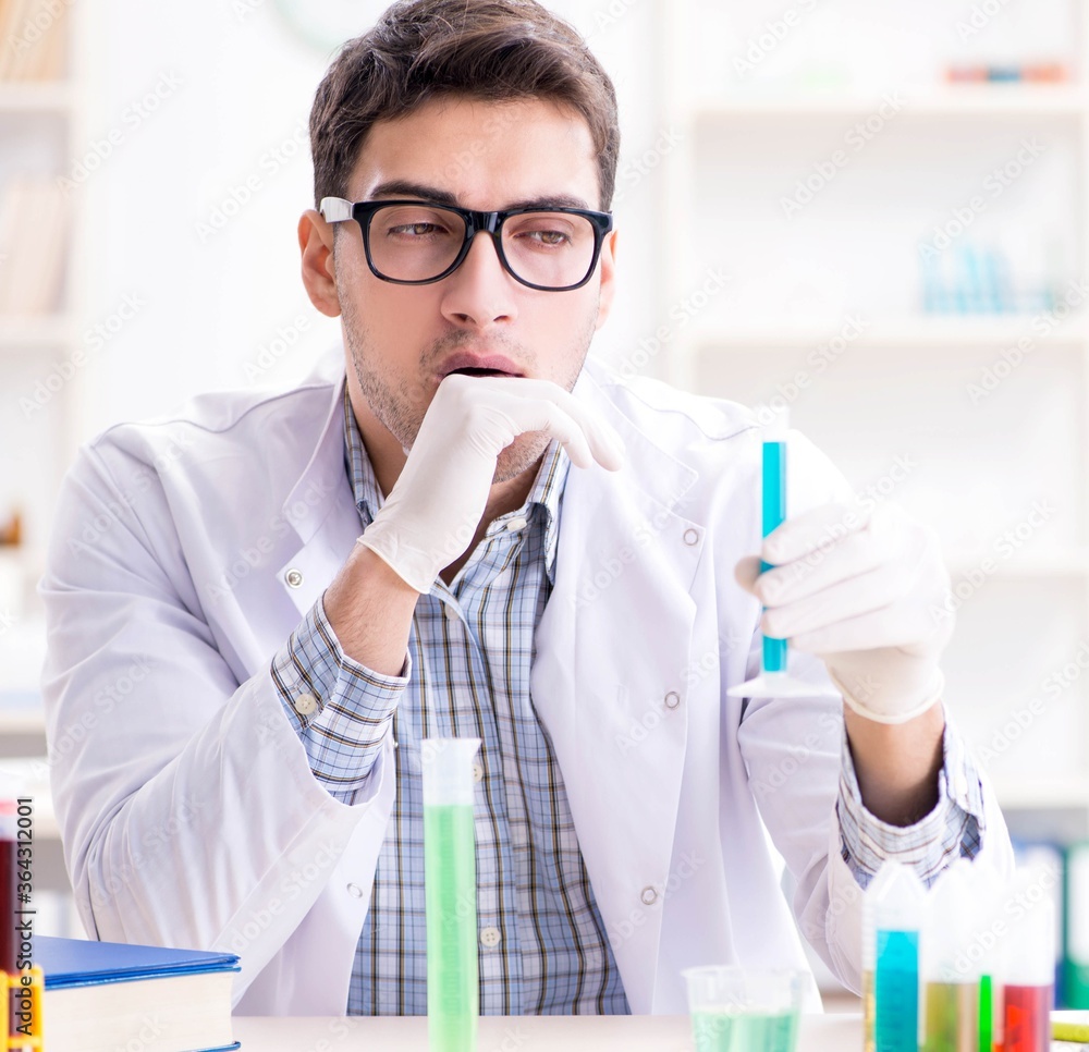 Chemistry student doing chemical experiments at classroom activi Chemistry student doing chemical experiments at classroom activi