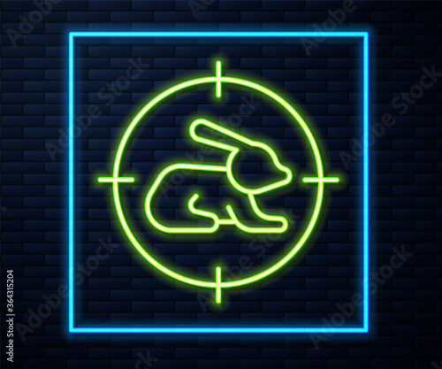 Glowing neon line Hunt on rabbit with crosshairs icon isolated on brick wall background. Hunting club logo with rabbit and target. Rifle lens aiming a hare. Vector.