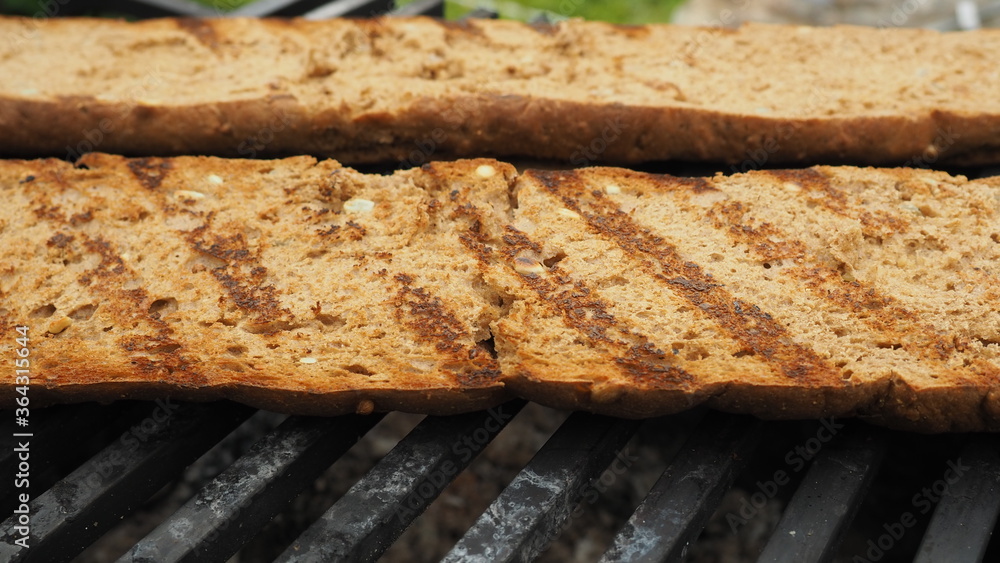 fried bread on the grill. the food on the fire fried bread on the grill. the food on the fire