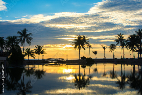 Beautiful sunset at a beach resort in tropics. © serra715
