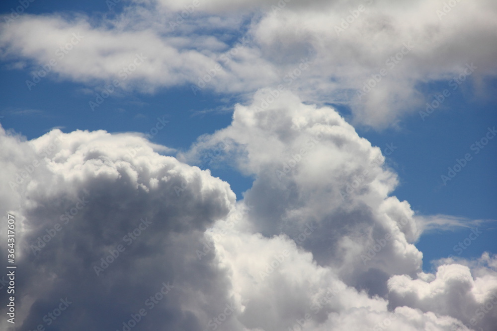 Blue sky with beautiful Cumulus clouds Sunny summer day close up, environment scene Blue sky with beautiful Cumulus clouds Sunny summer day close up, environment scene