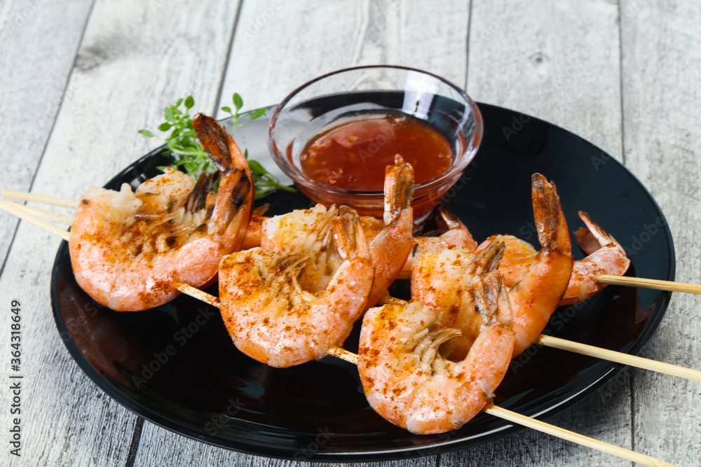 Grilled prawn skewer with sauce Grilled prawn skewer with sauce