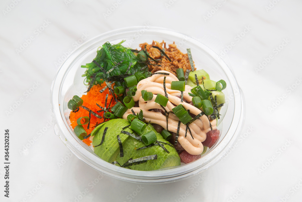 Poke Hawaiian dish, raw fish salad served as an appetizer or main course. Poke Hawaiian dish, raw fish salad served as an appetizer or main course.