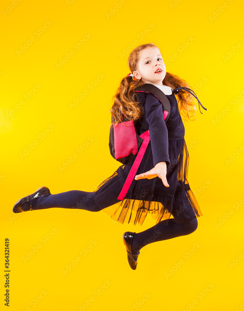 The elementary school girl with pink backpack The elementary school girl with pink backpack