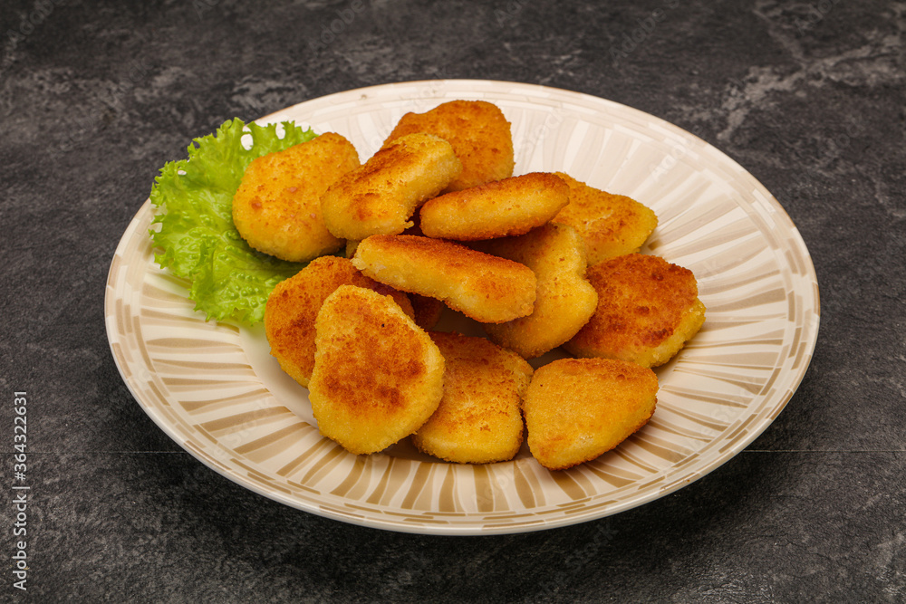 Fried chicken nuggets served salad leaves