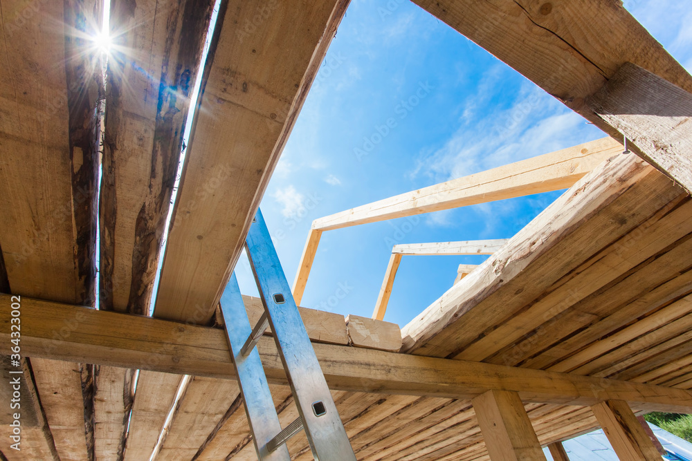 Obraz premium new house construction from wood and wooden beams and rafters