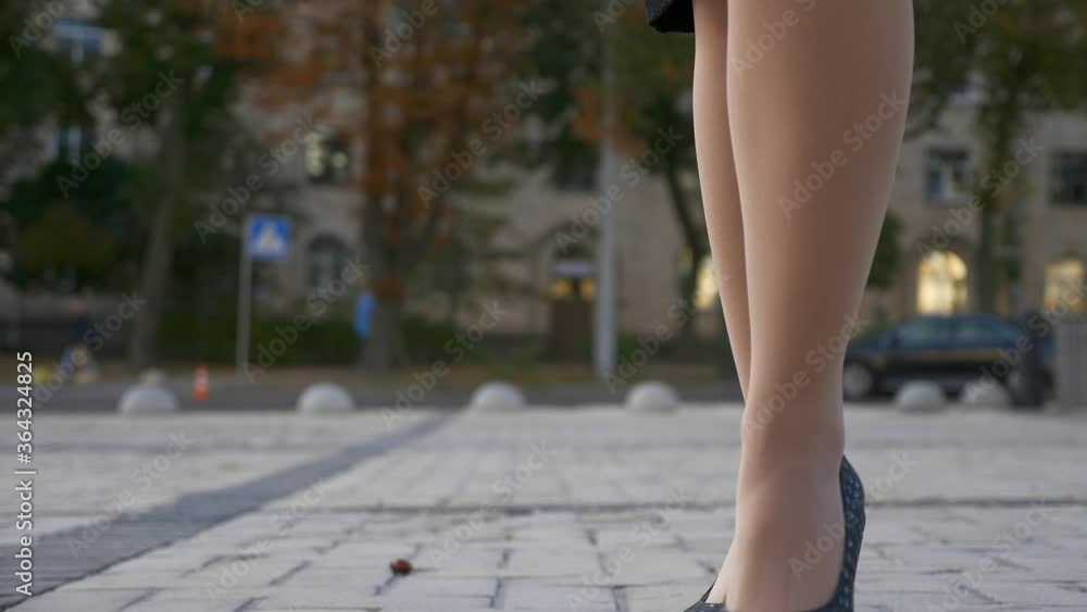 Close-up Female High Heels Footsteps on Brick Pavement. Urban Scene City Street Close-up Female High Heels Footsteps on Brick Pavement. Urban Scene City Street