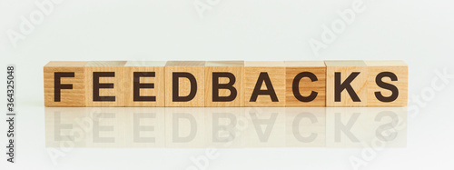 FEEDBACKS word written on wood block, business concept