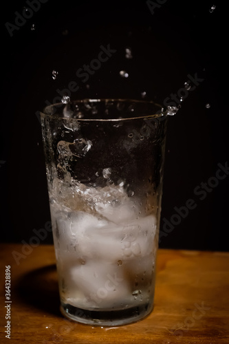 Old soda, glass and ice