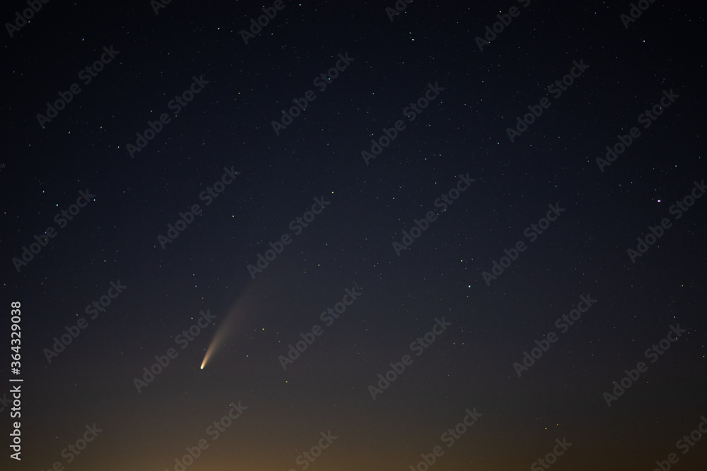 View of the C/2020 F3 (NEOWISE) comet with tail above Europe. Starry night sky. Photo taken on July 12, 2020 View of the C/2020 F3 (NEOWISE) comet with tail above Europe. Starry night sky. Photo taken on July 12, 2020