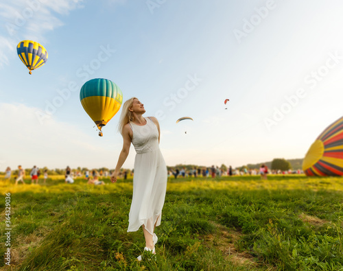 Amazing view with woman and air balloon. Artistic picture. Beauty world. The feeling of complete freedom