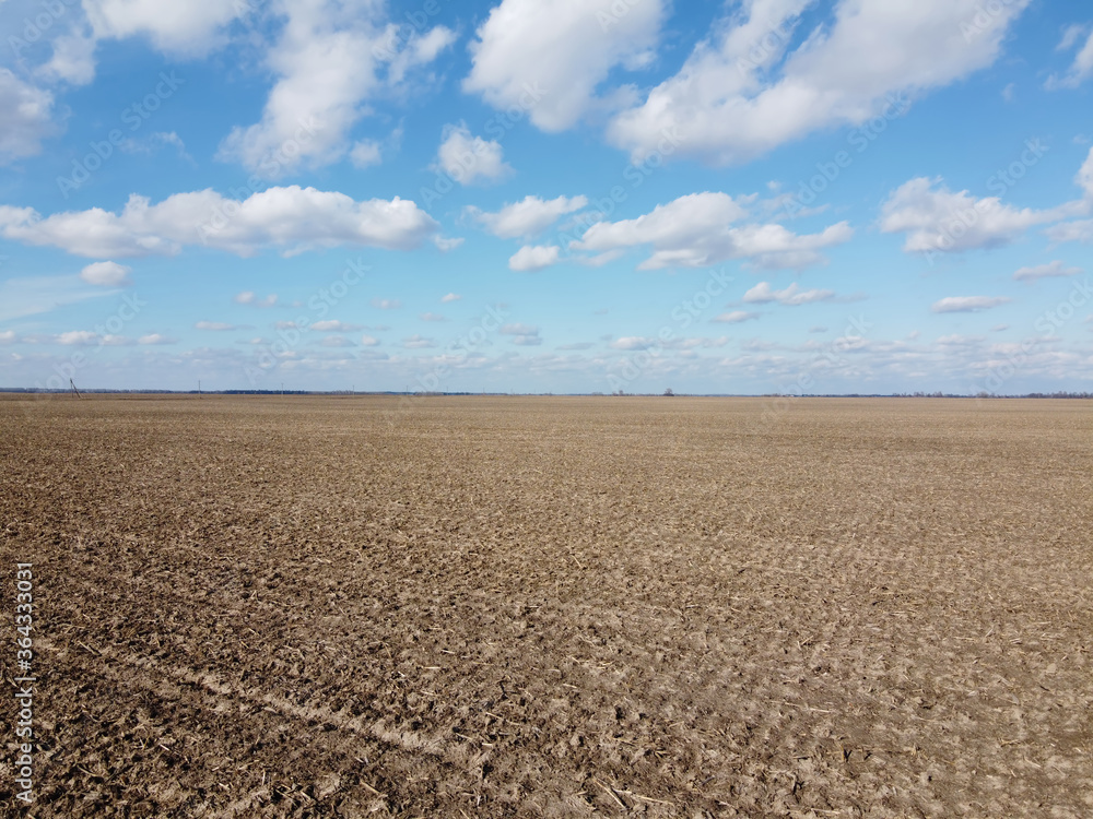 Beautiful blue sky over farm fields on a sunny day, aerial view. Landscape. Beautiful blue sky over farm fields on a sunny day, aerial view. Landscape.
