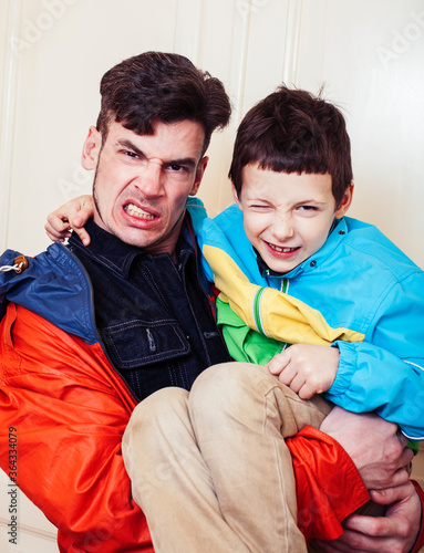 faher and son together having fun at home, lifestyle happy family, people at home photo