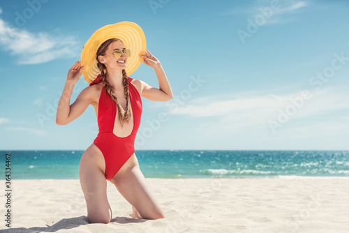 Woman in her beach vacation with ocean in the background