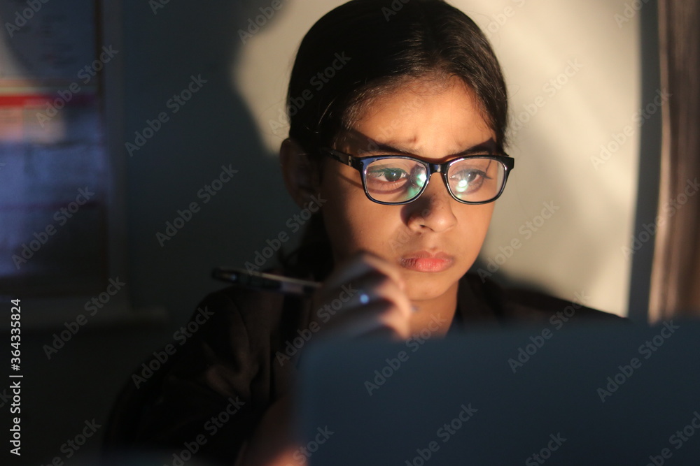a girl working from home during global corona pandemic. a girl working from home during global corona pandemic.