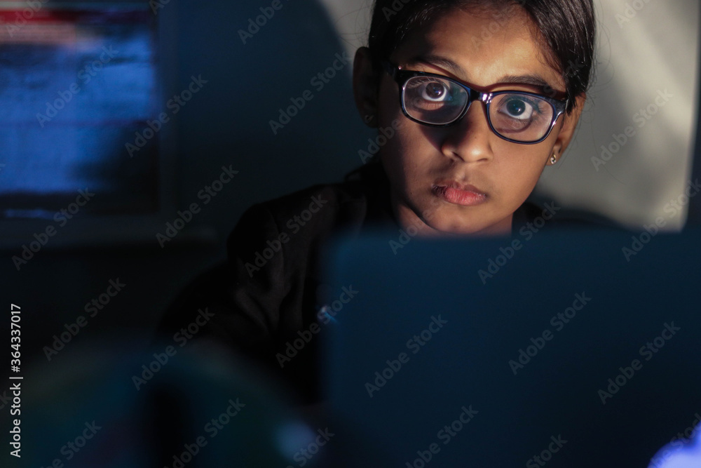 a girl working from home during global corona pandemic. a girl working from home during global corona pandemic.