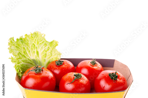 Fresh healthy tomatoes in an eco bag isolated on a white background. Shopping of organic and vegetarian food. Zero waste  eco friendly or plastic free lifestyle concept. Copy space.