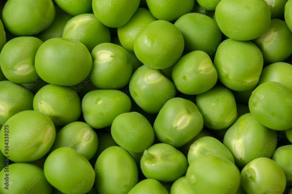 Fresh green peas as background texture close-up. Fresh green peas as background texture close-up.