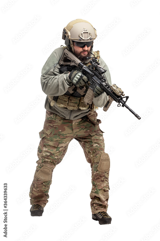 American soldier in military equipment with a rifle attacks on a white background, a commando with weapons in uniform, a ranger in action American soldier in military equipment with a rifle attacks on a white background, a commando with weapons in uniform, a ranger in action