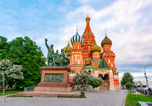 Monument to Minin and Pozharsky and Cathedral of Vasily the Blessed (Saint Basil's Cathedral) on Red Square at sunset, Moscow, Russia photo