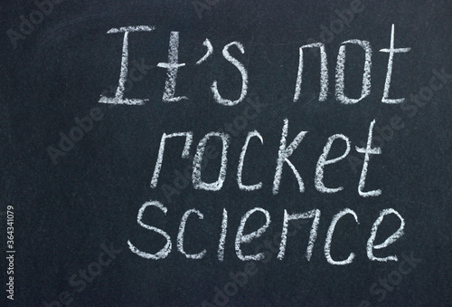 
The inscription on the dark board is "it's not rocket sciense". Motivating phrase