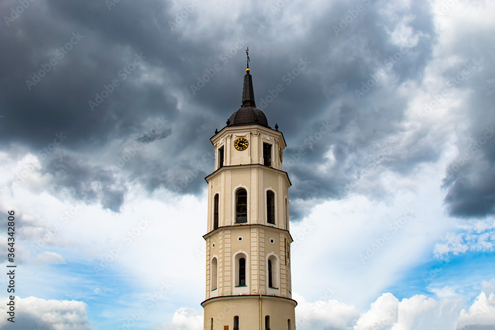 dark cloud above the clock tower in Vilnius