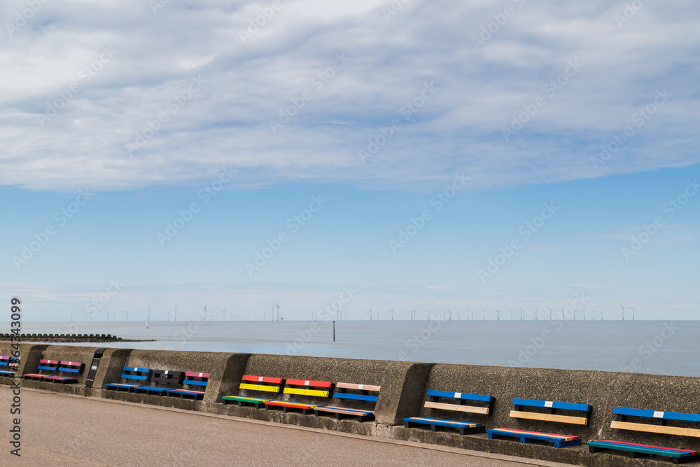 Colourful benches on Wallasey beach promenade