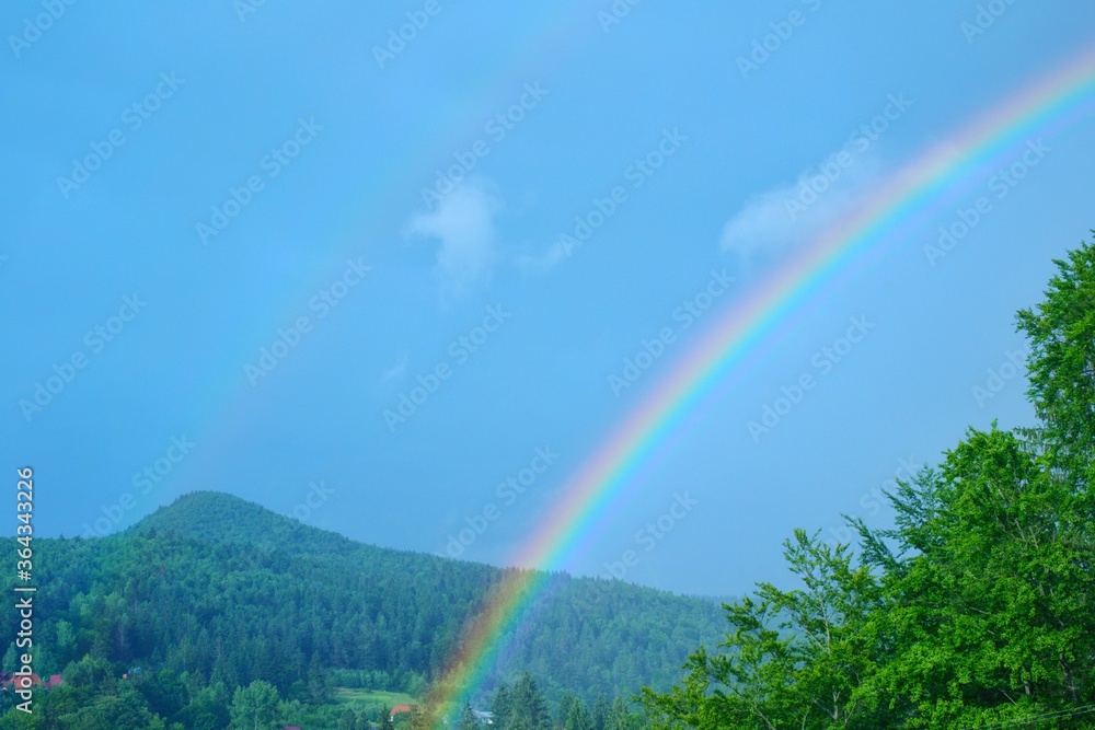 Mountain landscape in the Ukrainian Carpathians with rainbow